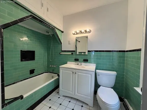a bathroom with a sink toilet and tub
