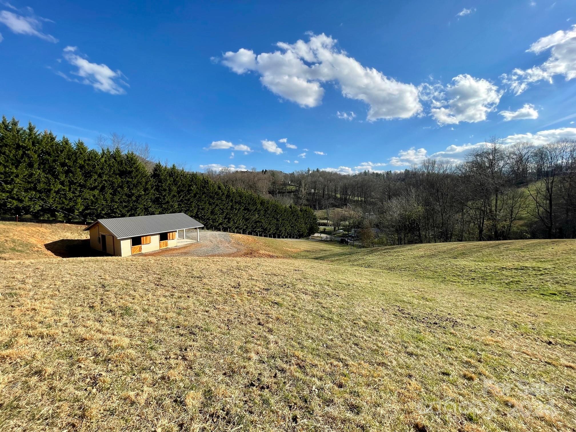 50 Glance Cove Road Clyde, NC 28721 - Photo 1 of 27 a swimming pool with an outdoor space and seating