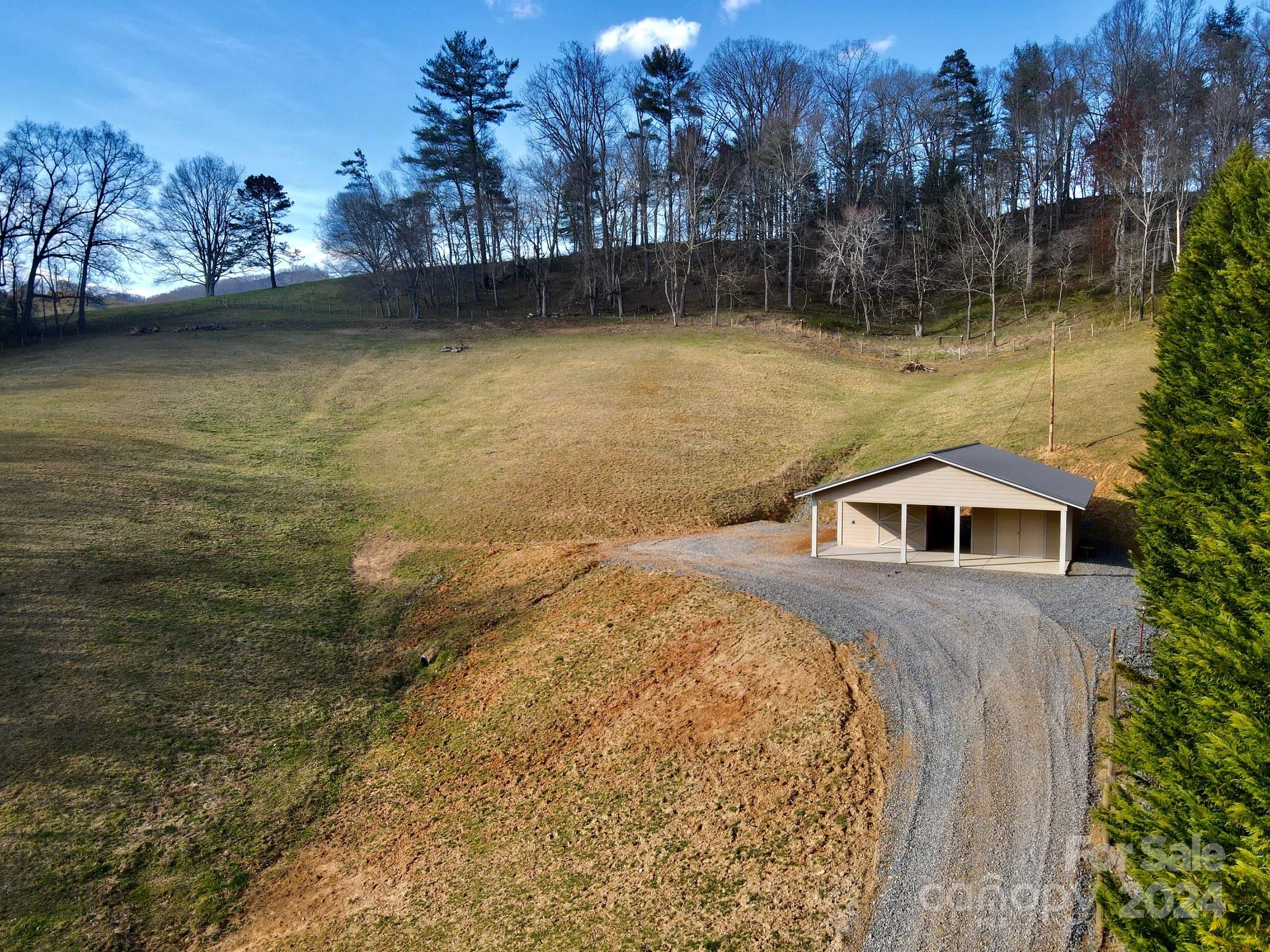 50 Glance Cove Road Clyde, NC 28721 - Photo 15 of 27 a view of a large body of water with lots of trees in the background