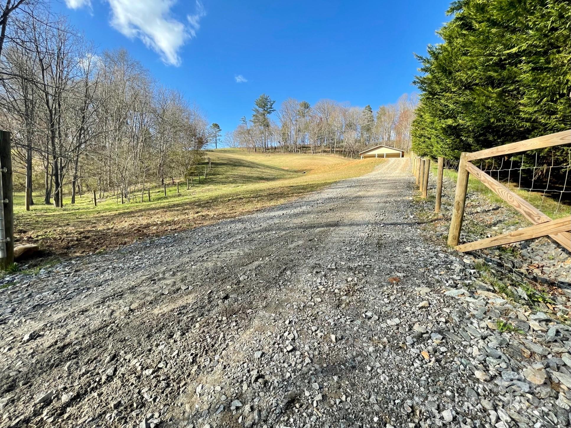 50 Glance Cove Road Clyde, NC 28721 - Photo 21 of 27 a view of a yard with a tree