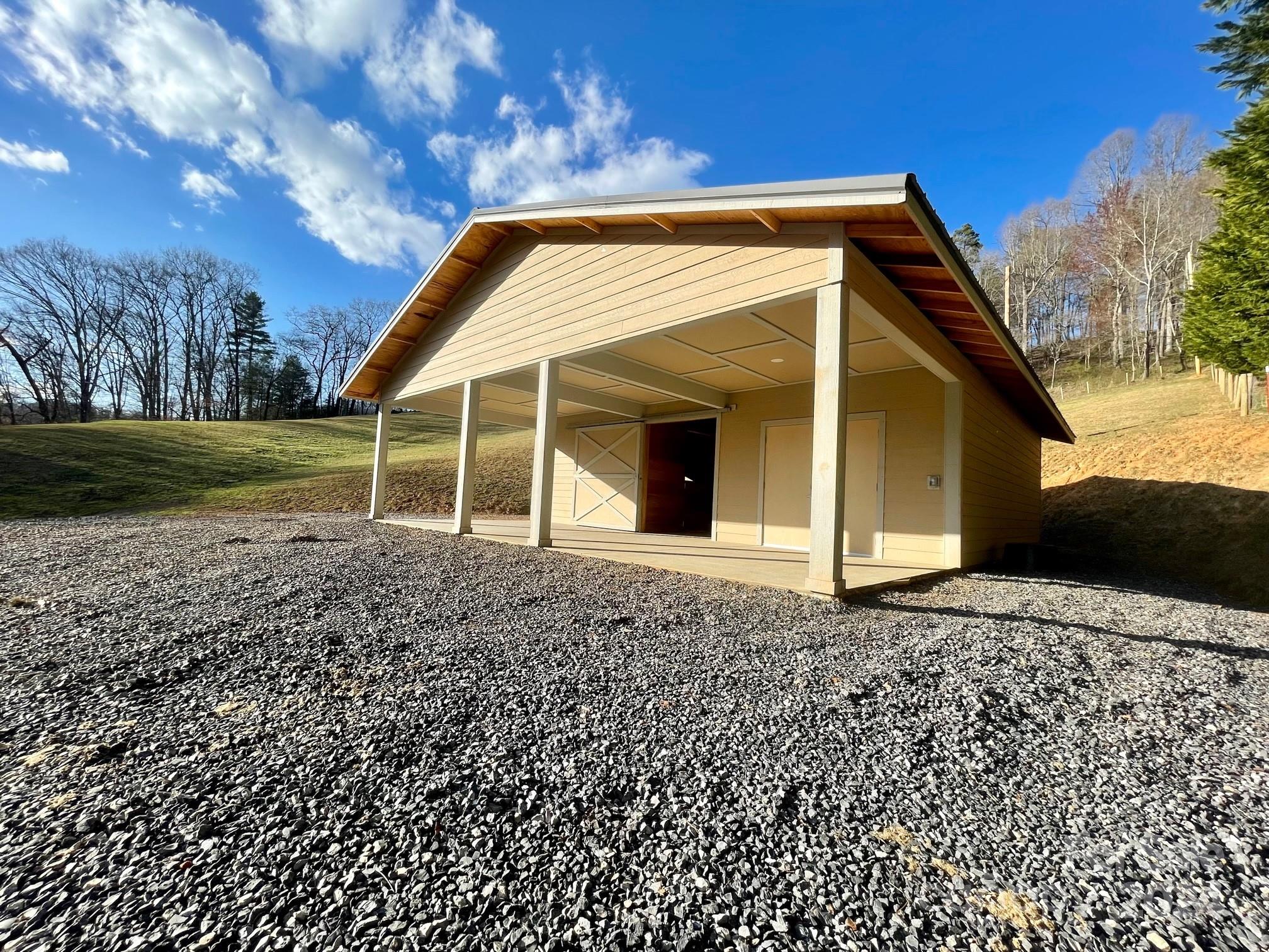 50 Glance Cove Road Clyde, NC 28721 - Photo 3 of 27 a view of a house with a yard