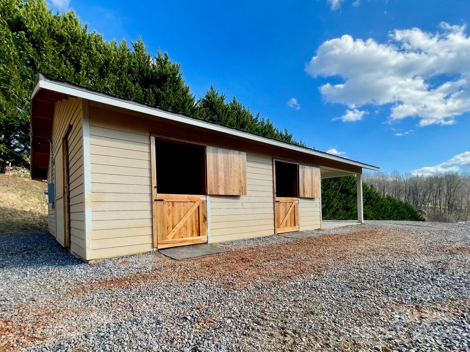 50 Glance Cove Road Clyde, NC 28721 - Photo 5 of 27 a view of a house with a backyard