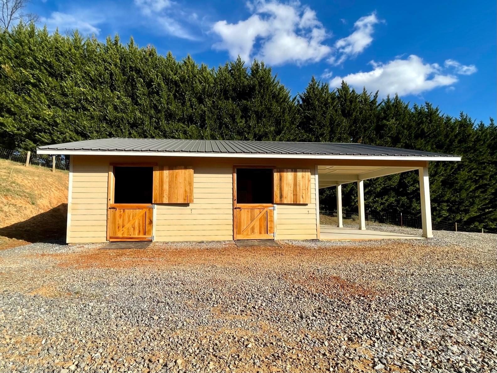 50 Glance Cove Road Clyde, NC 28721 - Photo 7 of 27 a view of a house with a outdoor space