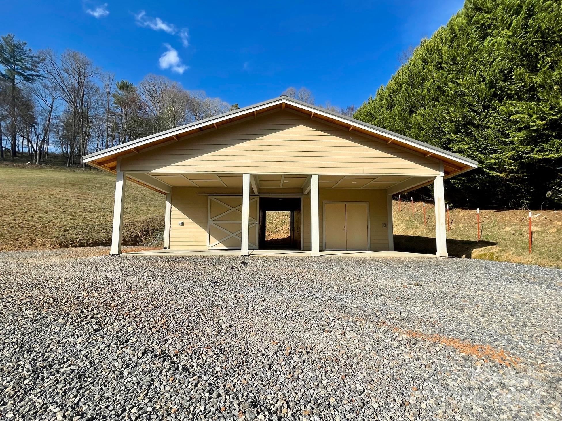 50 Glance Cove Road Clyde, NC 28721 - Photo 8 of 27 a view of a house with a yard