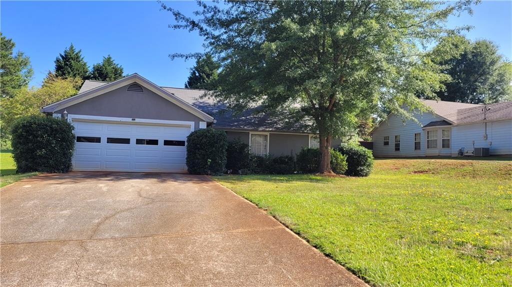 4104 Chapel Mill Bend Decatur, GA 30034 - Photo 1 of 1 a front view of a house with a yard and garage