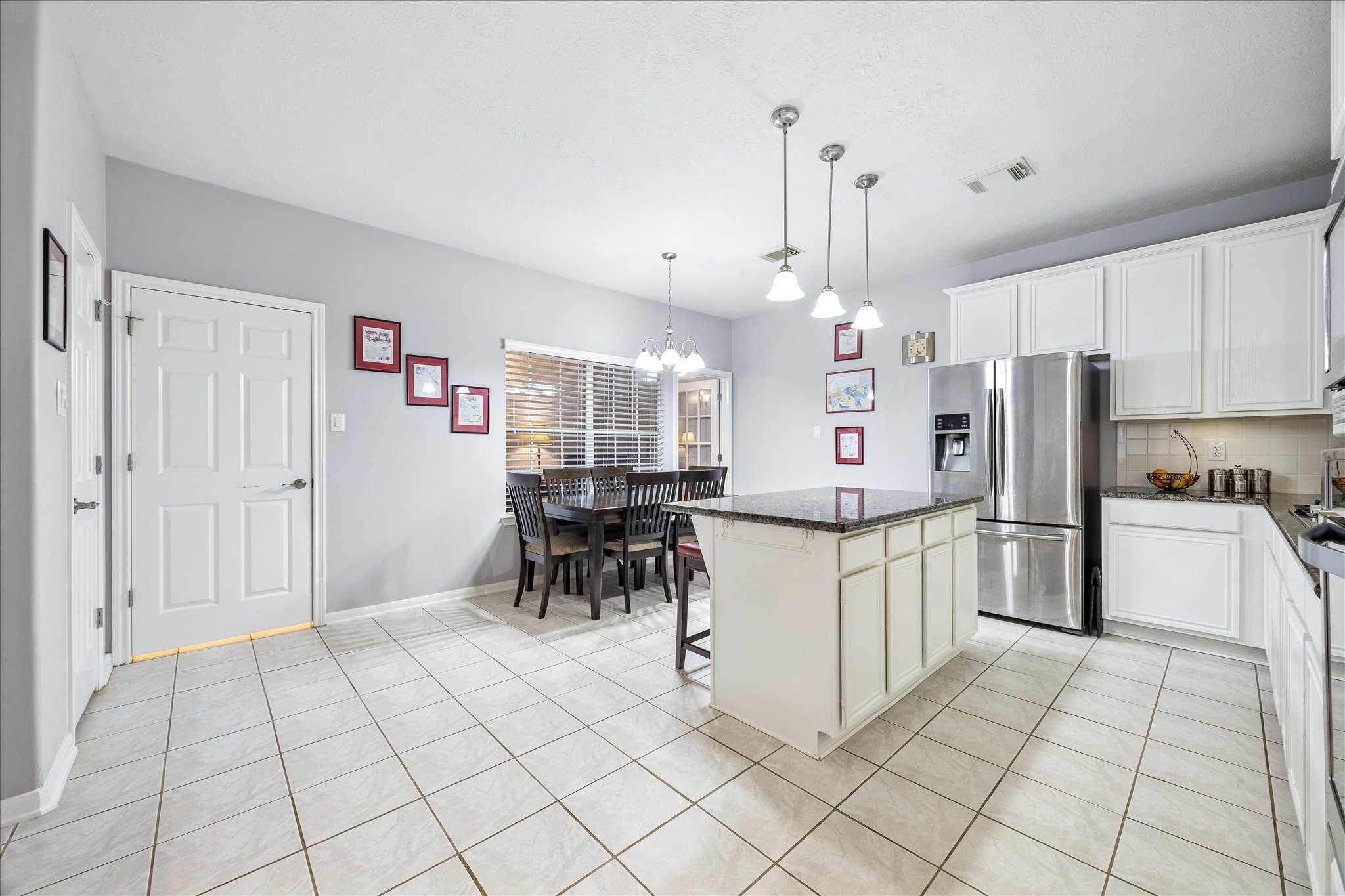 12423 Rutgers Park Court Houston, TX 77058 - Photo 13 of 29 a kitchen with stainless steel appliances a refrigerator sink and cabinets