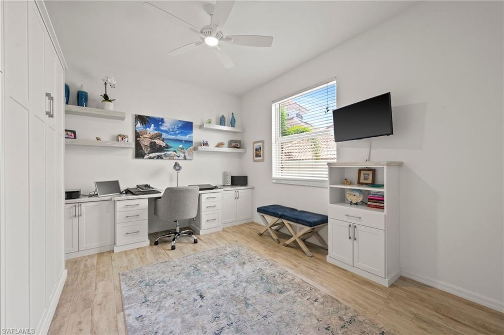 450 Launch Circle, Unit 201 Naples, FL 34108 - Photo 19 of 43 a view of a workspace with furniture and a window