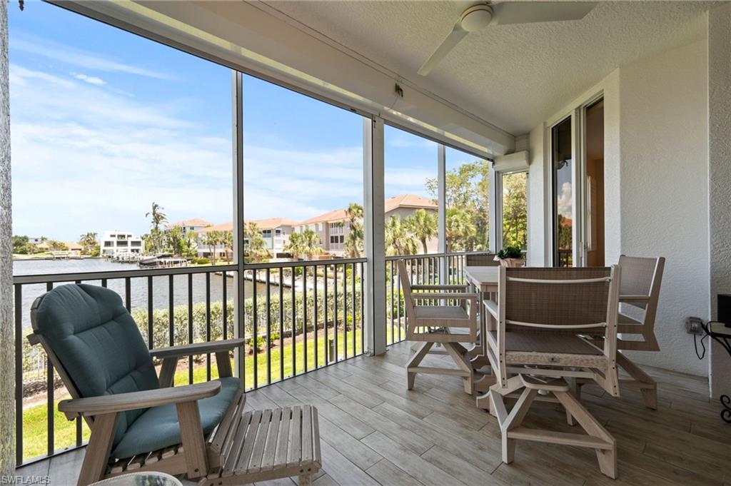 450 Launch Circle, Unit 201 Naples, FL 34108 - Photo 25 of 43 a view of a chairs in balcony
