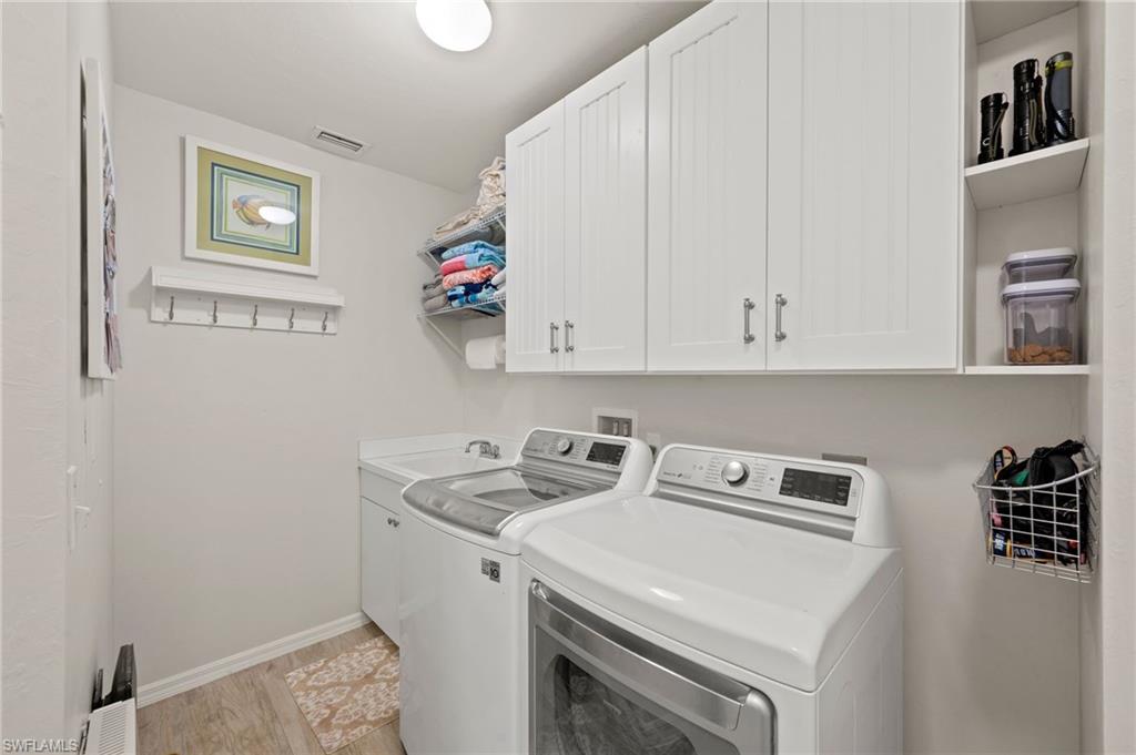 450 Launch Circle, Unit 201 Naples, FL 34108 - Photo 27 of 43 a utility room with dryer and washer