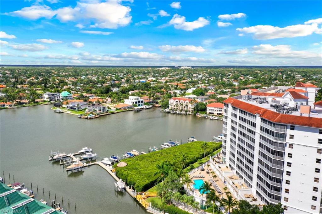450 Launch Circle, Unit 201 Naples, FL 34108 - Photo 33 of 43 a view of a lake with a city