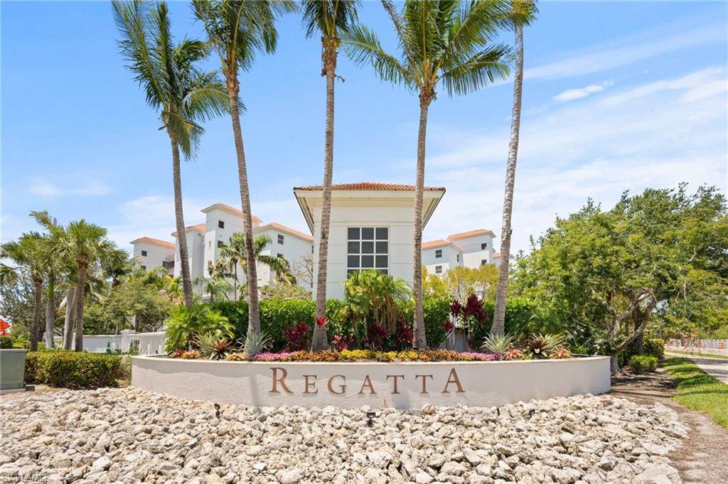 450 Launch Circle, Unit 201 Naples, FL 34108 - Photo 43 of 43 a front view of a house with garden