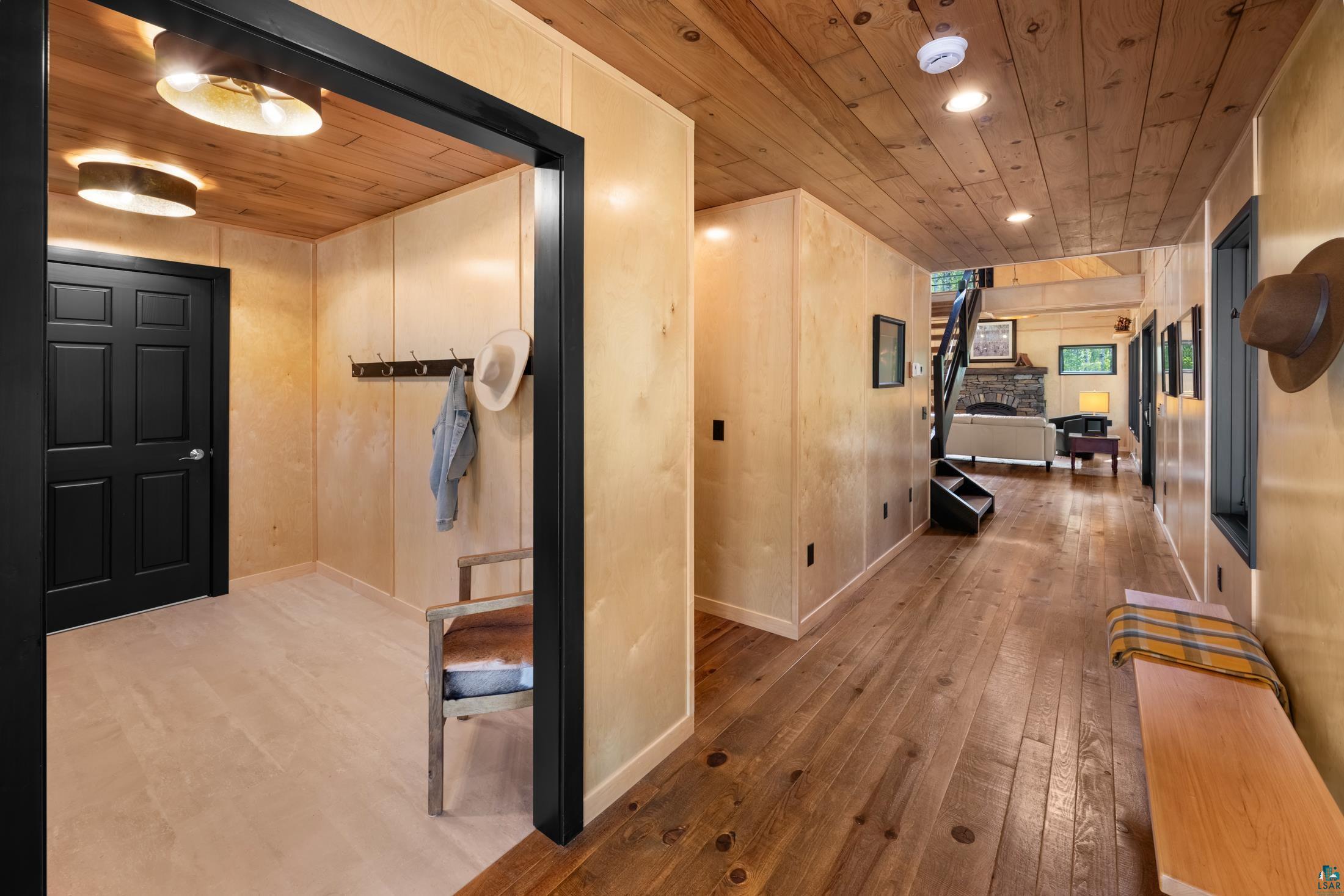 3778 East County Road Barnum, MN 55707 - Photo 15 of 52 Wood-paneled ceilings, wood-finish flooring, recessed lighting, and black trim accents