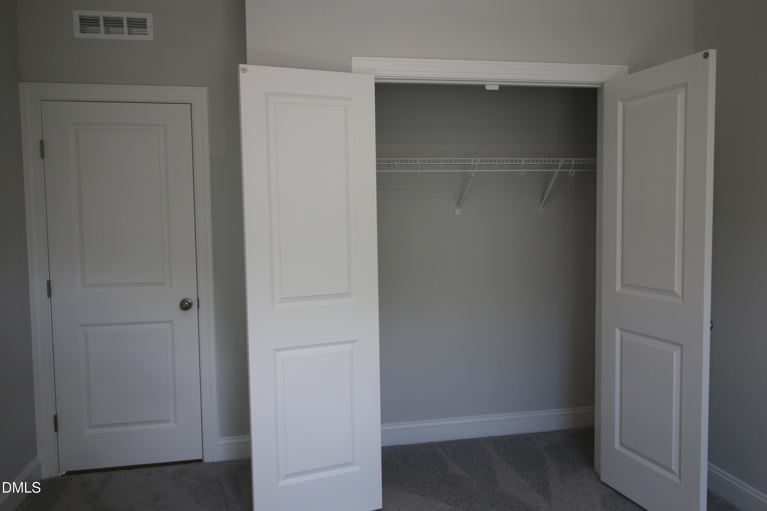 1201 Cosmic Drive Durham, NC 27703 - Photo 18 of 51 a view of walk in closet with empty racks