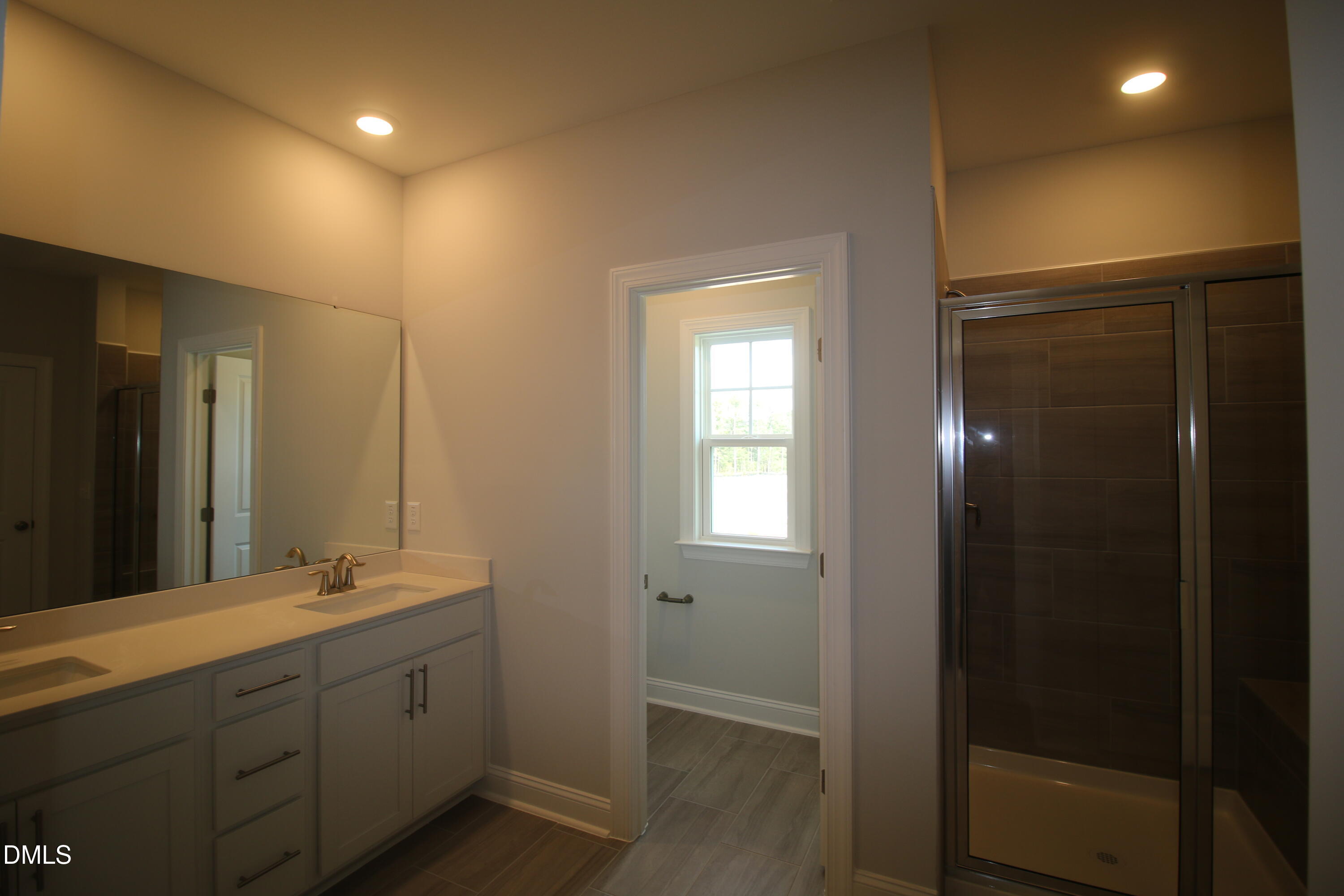 1201 Cosmic Drive Durham, NC 27703 - Photo 21 of 51 a bathroom with double vanity sink and a mirror