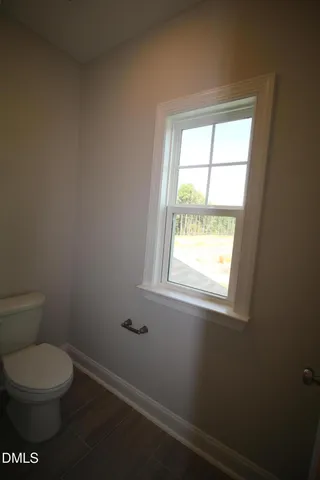 a view of a bathroom with a shower and closet