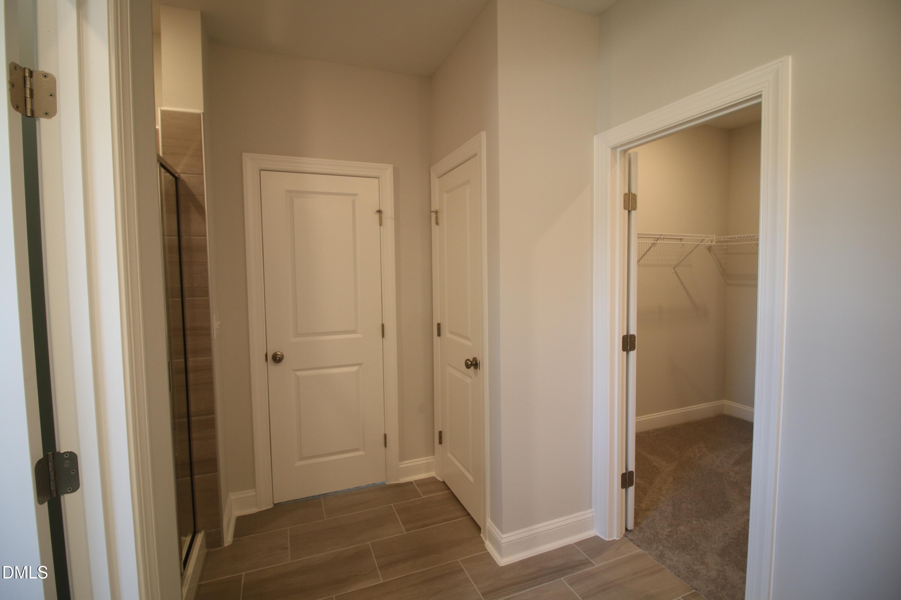 1201 Cosmic Drive Durham, NC 27703 - Photo 23 of 51 a view of a bathroom with a shower and closet