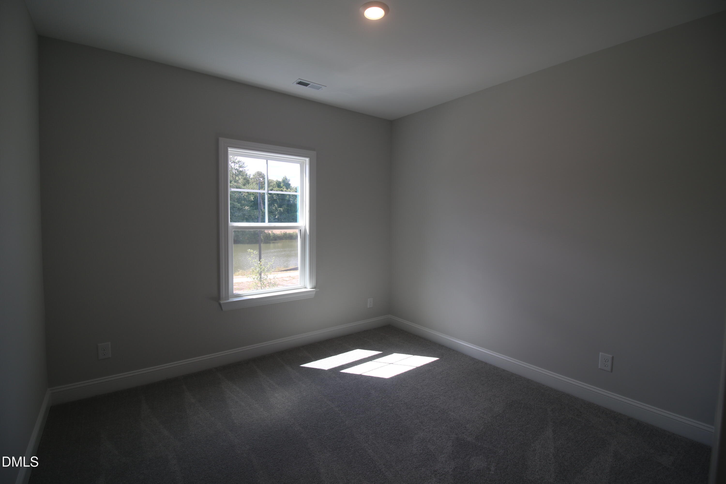 1201 Cosmic Drive Durham, NC 27703 - Photo 31 of 51 an empty room with a window