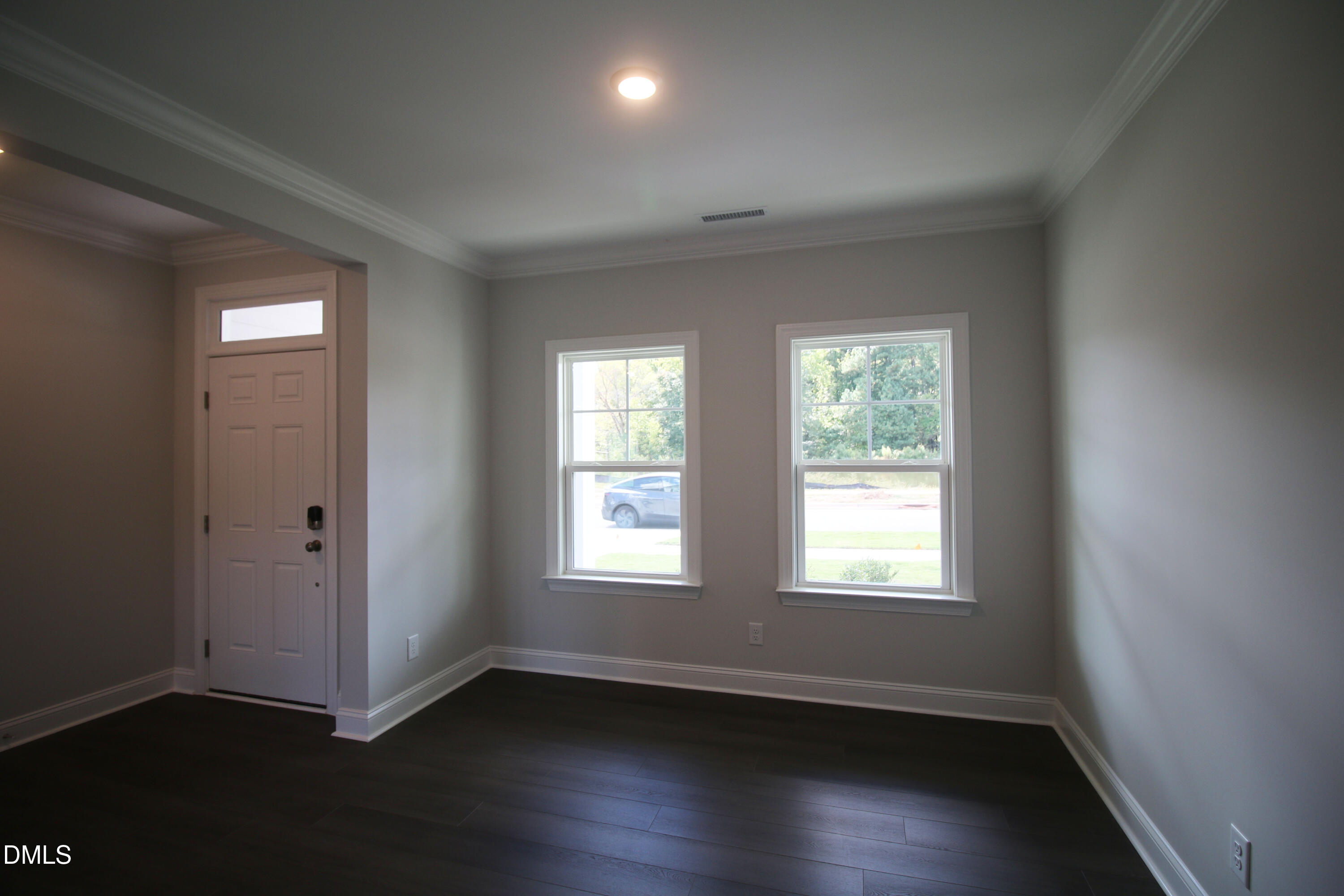 1201 Cosmic Drive Durham, NC 27703 - Photo 37 of 51 a view of an empty room with wooden floor and a window