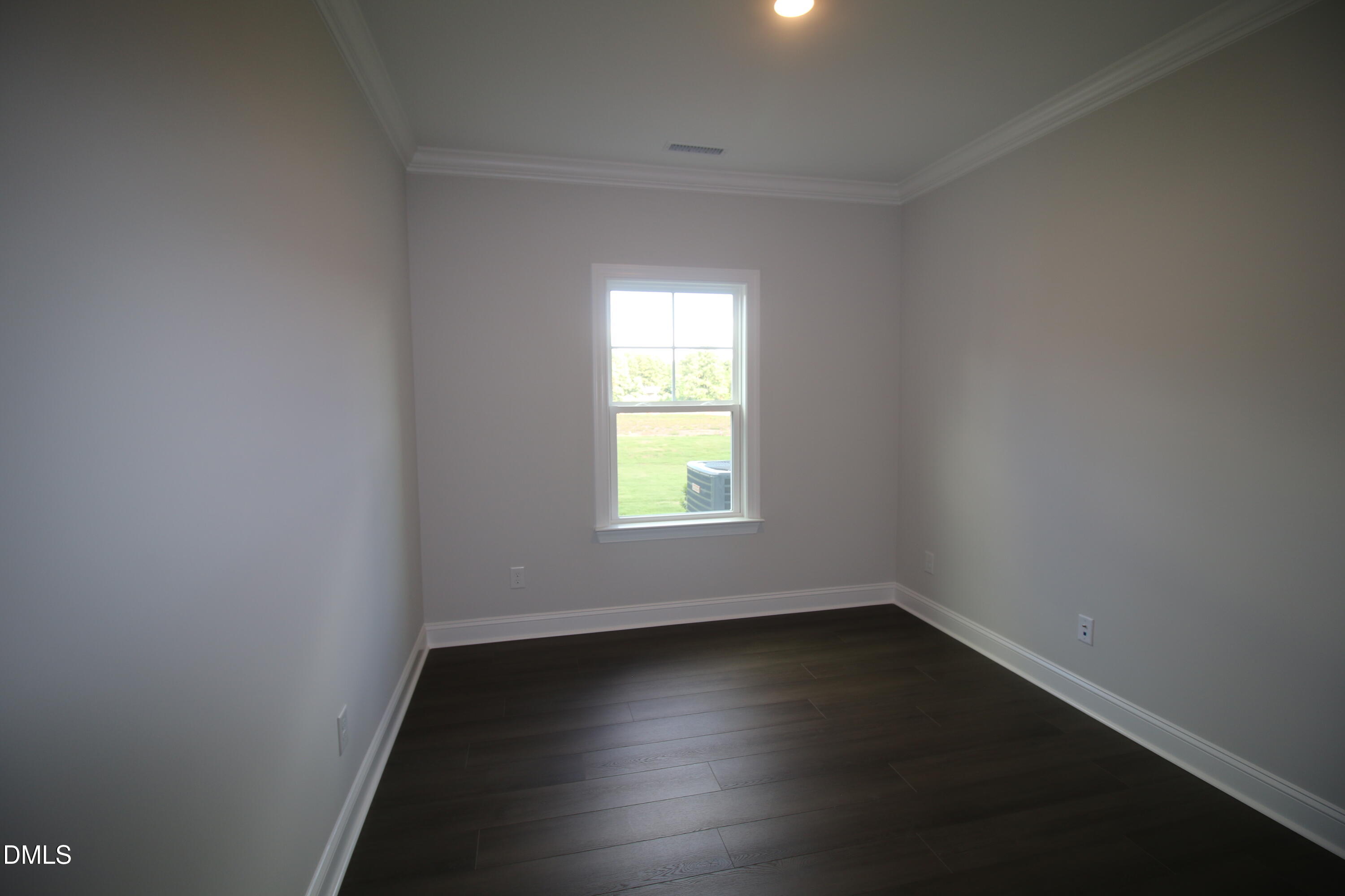 1201 Cosmic Drive Durham, NC 27703 - Photo 38 of 51 an empty room with wooden floor and windows