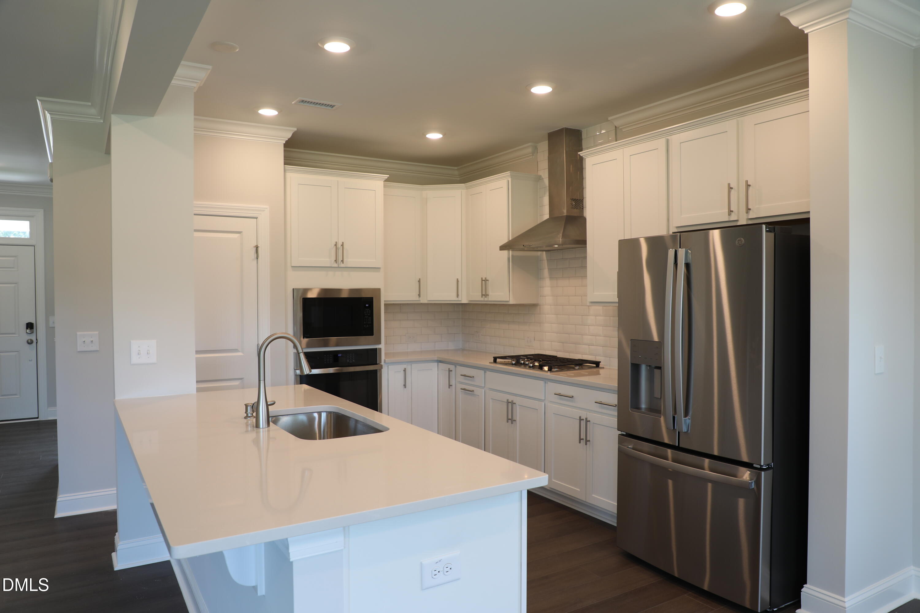 1201 Cosmic Drive Durham, NC 27703 - Photo 6 of 51 a kitchen with stainless steel appliances granite countertop a refrigerator a stove a sink and a microwave