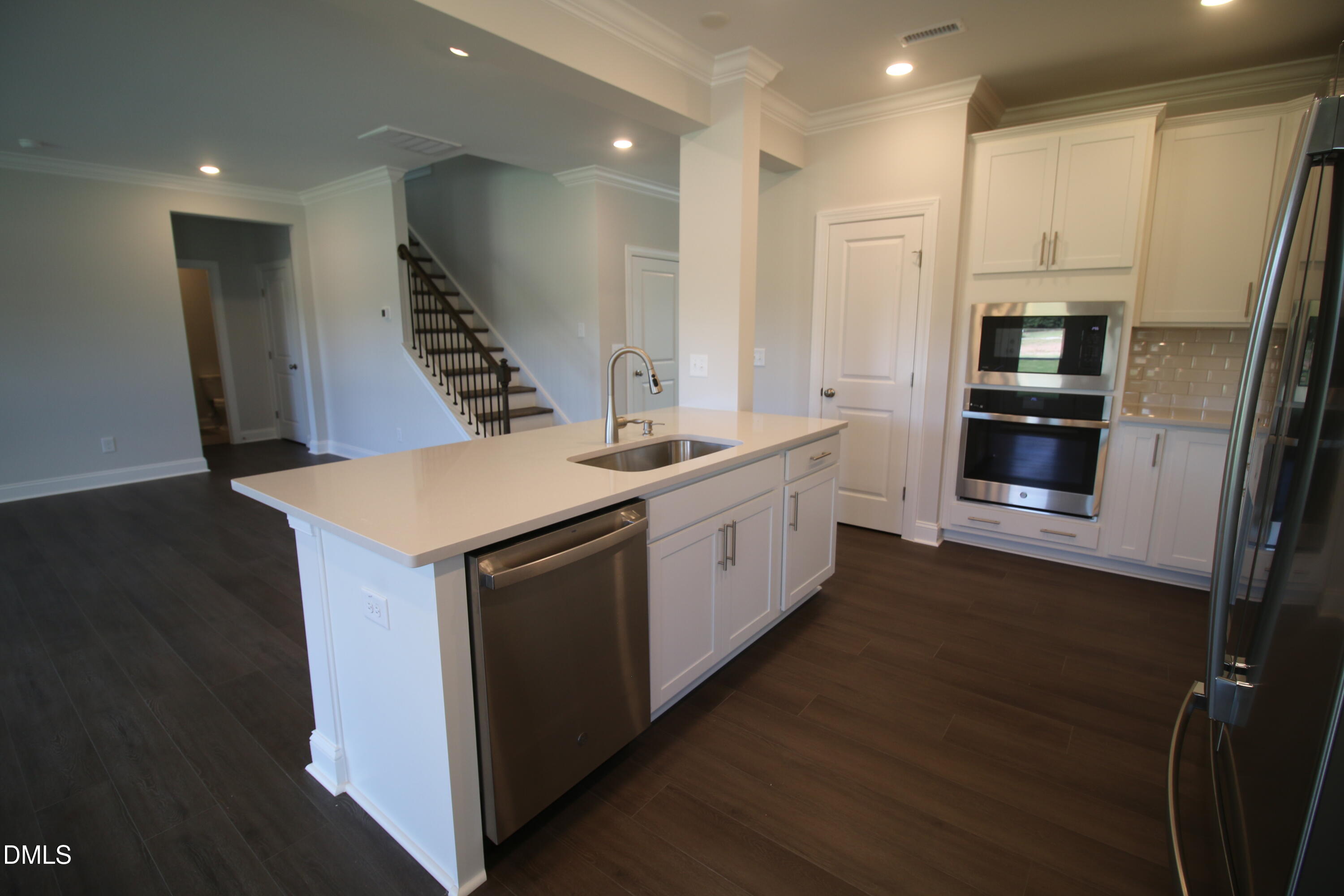 1201 Cosmic Drive Durham, NC 27703 - Photo 9 of 51 a kitchen with a sink and a refrigerator