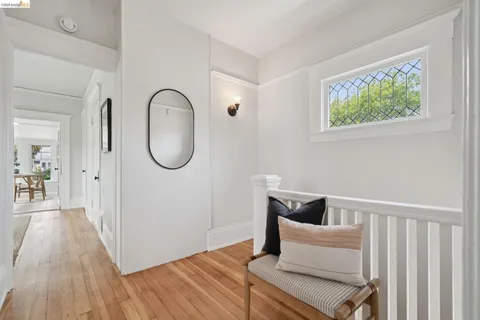 a living room with furniture a large window and a table