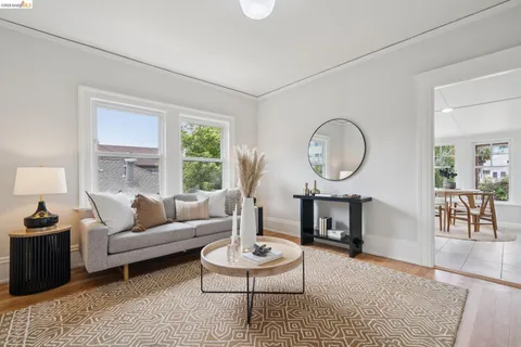 a living room with furniture and a table