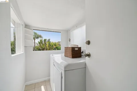 a bathroom with a sink mirror bathtub and toilet