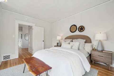 a bedroom with a bed and a chair