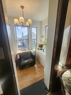 a view of a chairs and table in the balcony