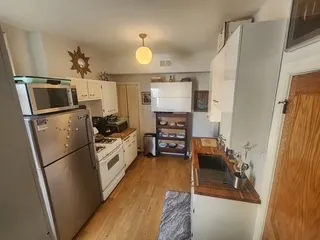 a kitchen with stainless steel appliances a refrigerator stove and sink
