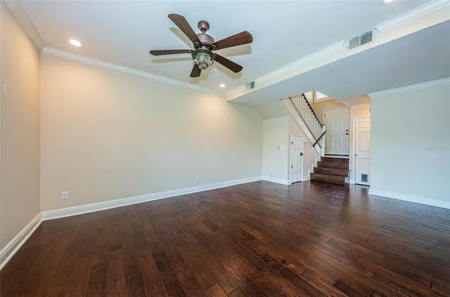 a view of walk in closet with empty racks