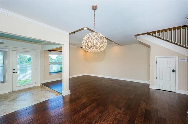 a room with wooden floor and window