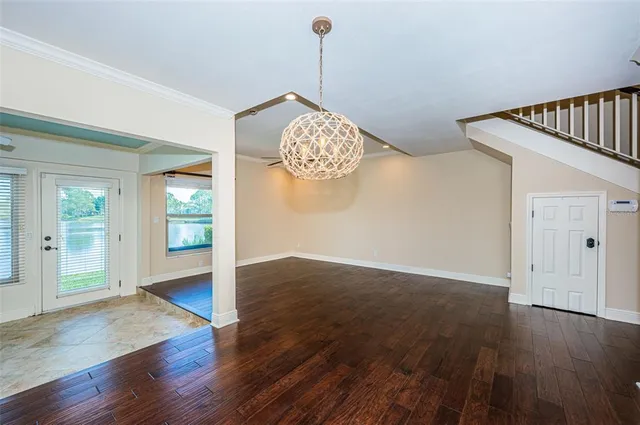 a room with wooden floor and window