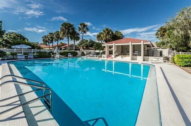 a kitchen with microwave a stove and cabinets