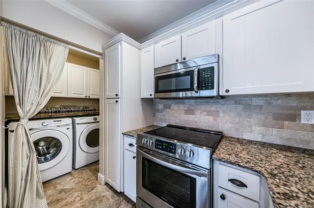 a view of a lake with couches and city view