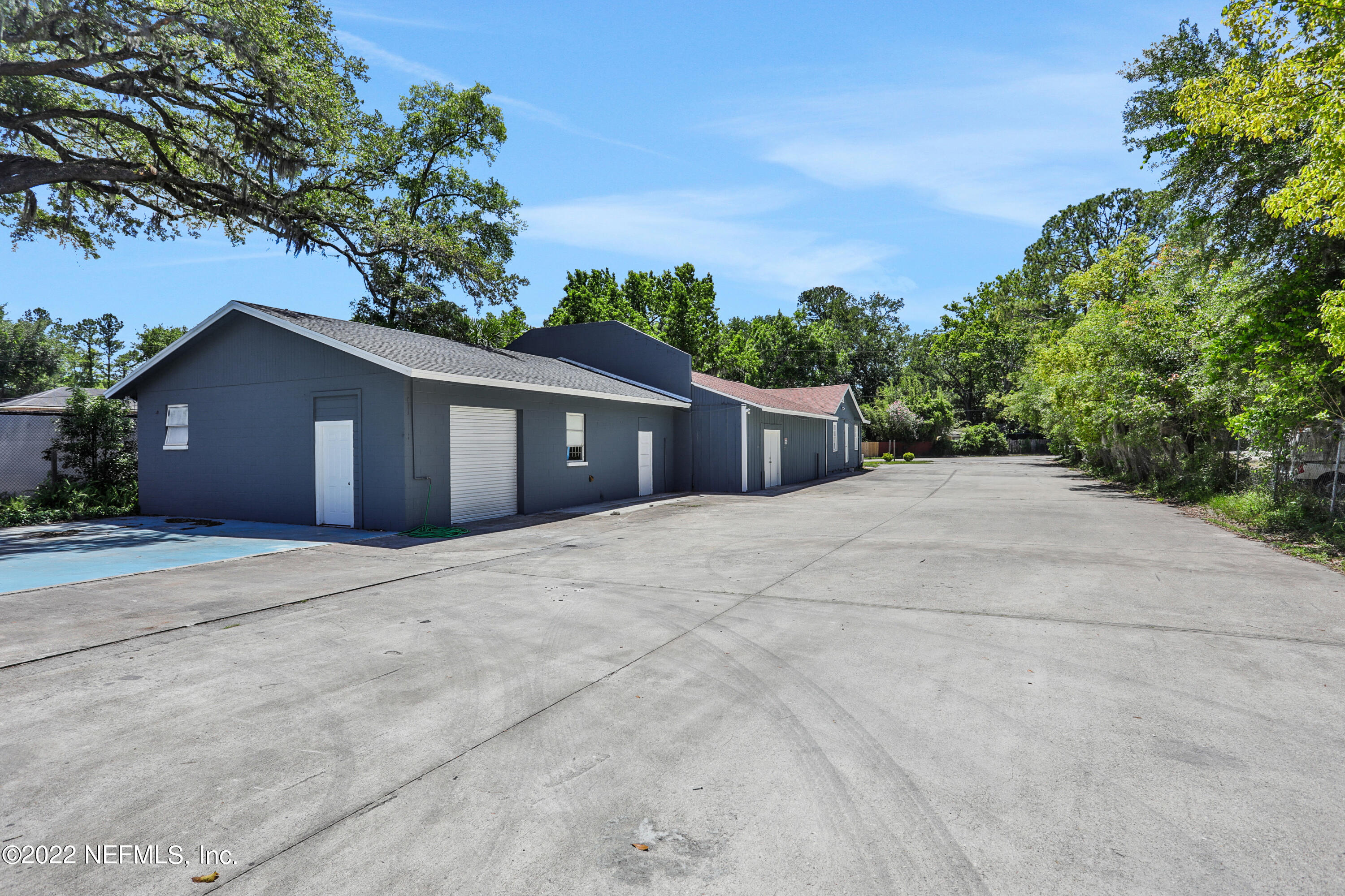 5645 St Augustine Road Jacksonville, FL 32207 - Photo 3 of 11 a house with trees in the background