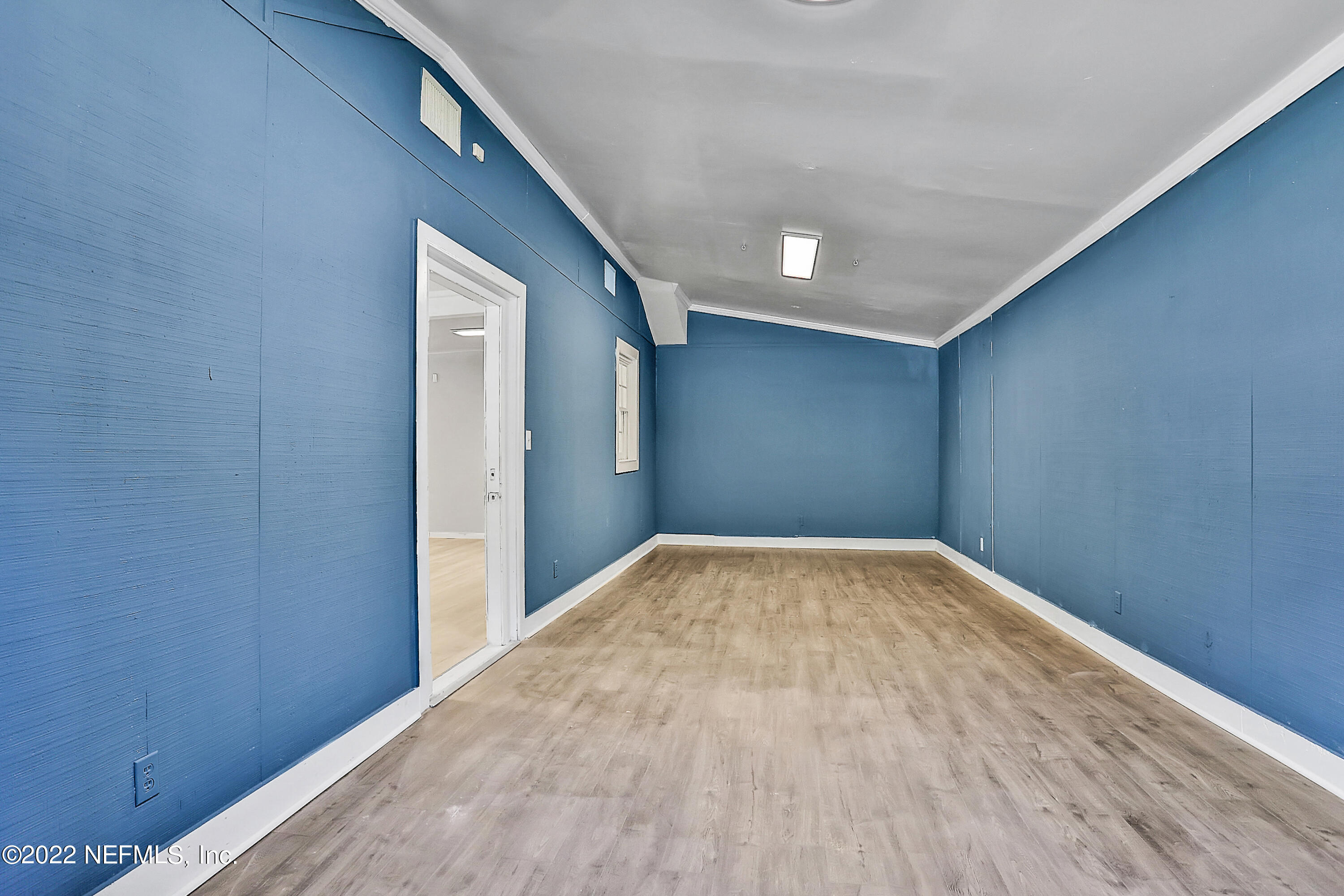 5645 St Augustine Road Jacksonville, FL 32207 - Photo 7 of 11 a view of empty room with wooden floor