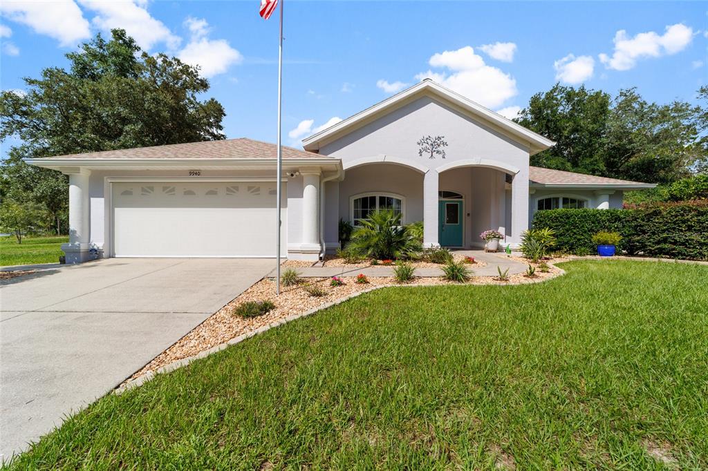 9940 North Langdon Road Citrus Springs, FL 34434 - Photo 1 of 1 a front view of house with yard