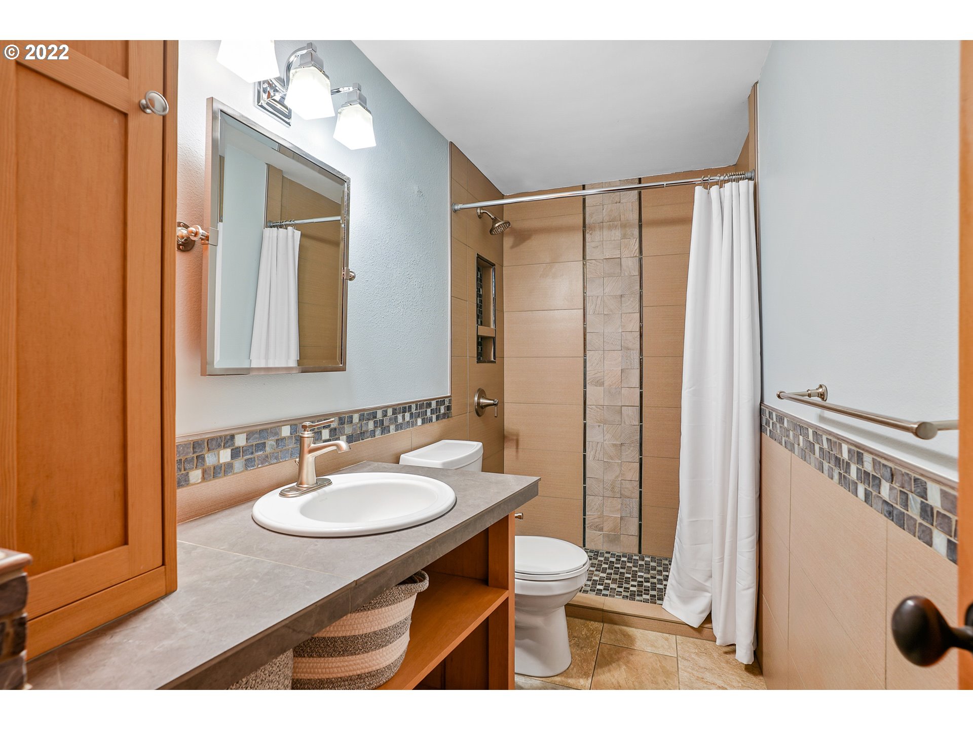 35719 Southeast Lusted Road Boring, OR 97009 - Photo 22 of 32 a bathroom with a sink mirror and a shower