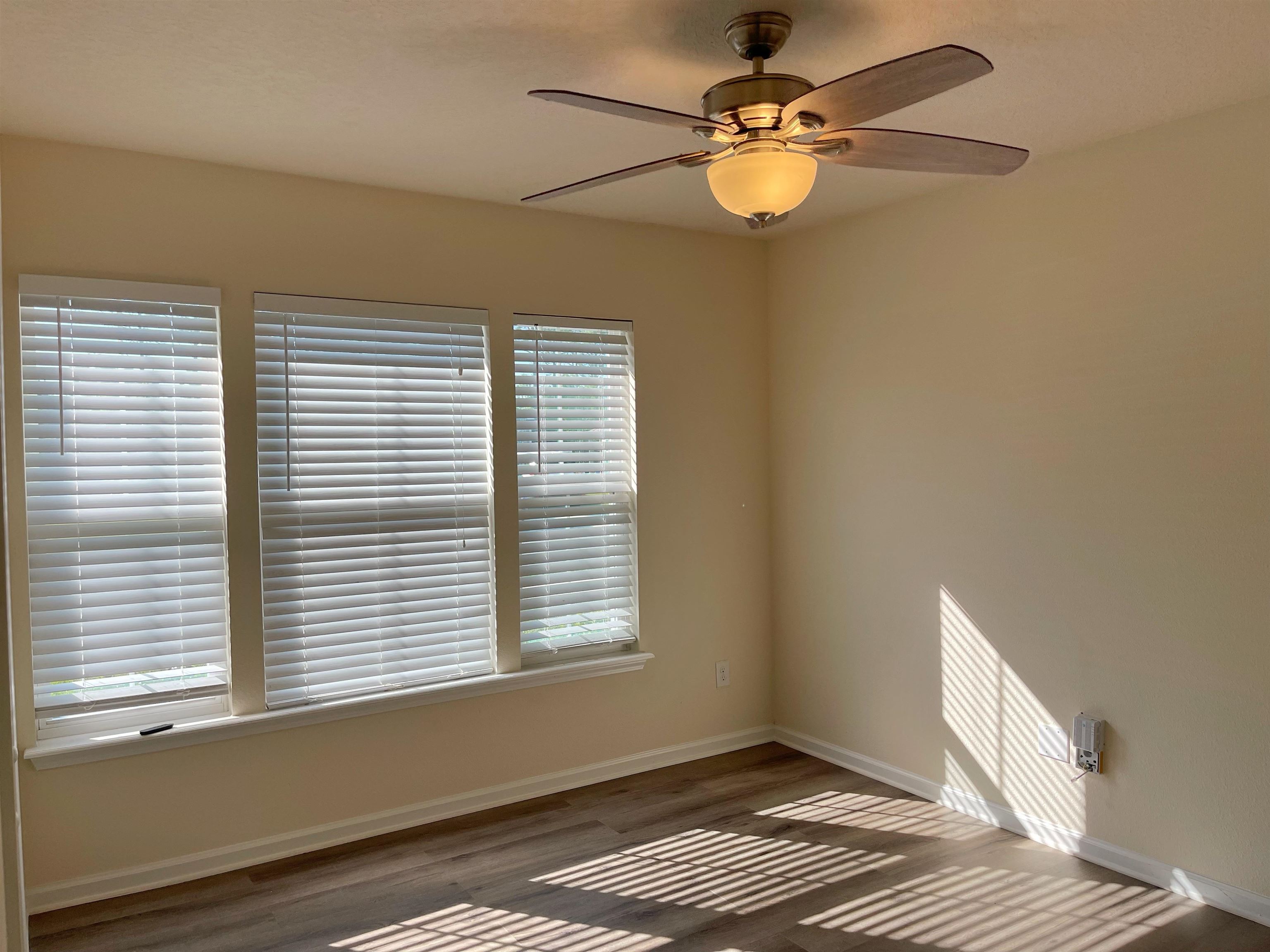 578 Deer Crossing Road St. Augustine, FL 32086 - Photo 19 of 28 a view of an empty room with a window and a fan