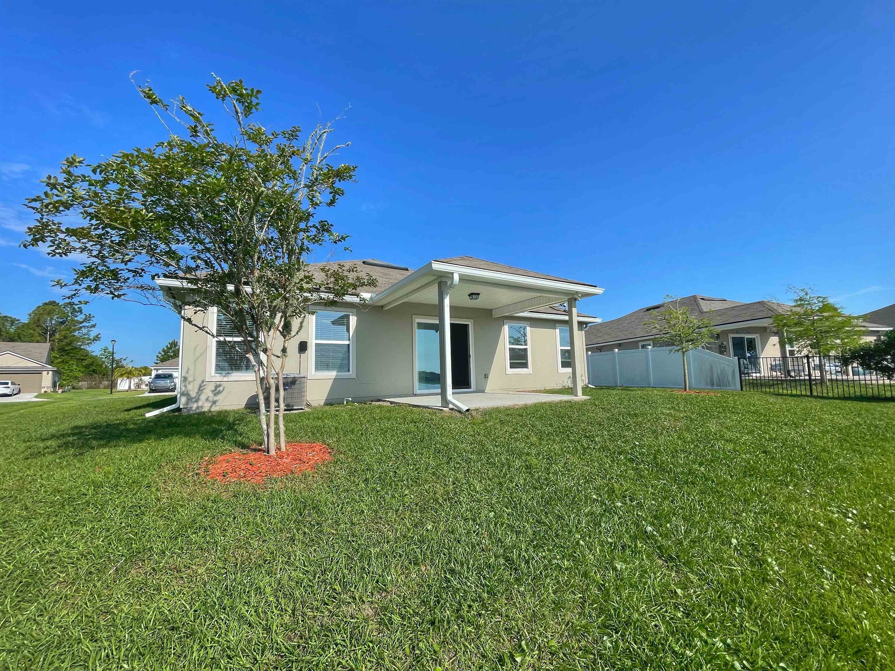 578 Deer Crossing Road St. Augustine, FL 32086 - Photo 23 of 28 a view of a house with a backyard