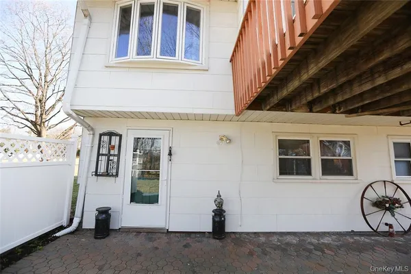 a view of a house with wooden fence