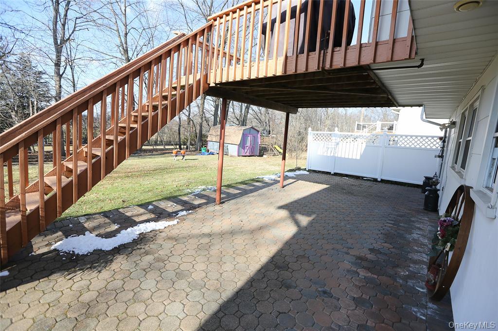 40 Bluefields Lane Blauvelt, NY 10913 - Photo 3 of 11 a view of a porch with wooden floor and backyard space