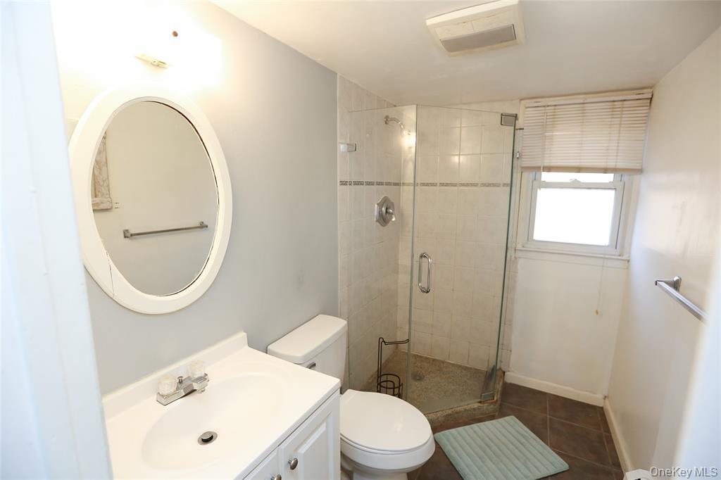 40 Bluefields Lane Blauvelt, NY 10913 - Photo 7 of 11 a bathroom with a toilet a sink and a mirror