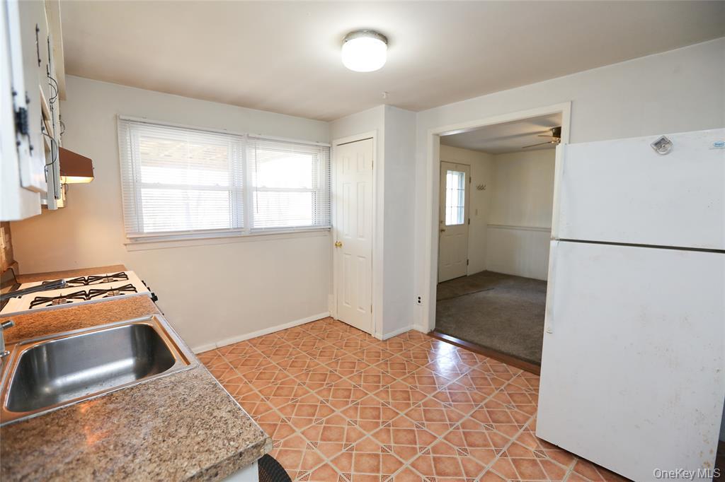 40 Bluefields Lane Blauvelt, NY 10913 - Photo 8 of 11 a kitchen with a stove and a refrigerator
