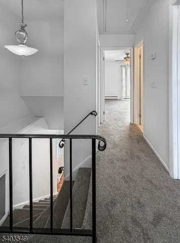 a view of a hallway with two rooms