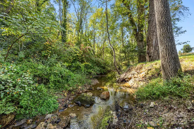 a kitchen with a sink stove and microwave
