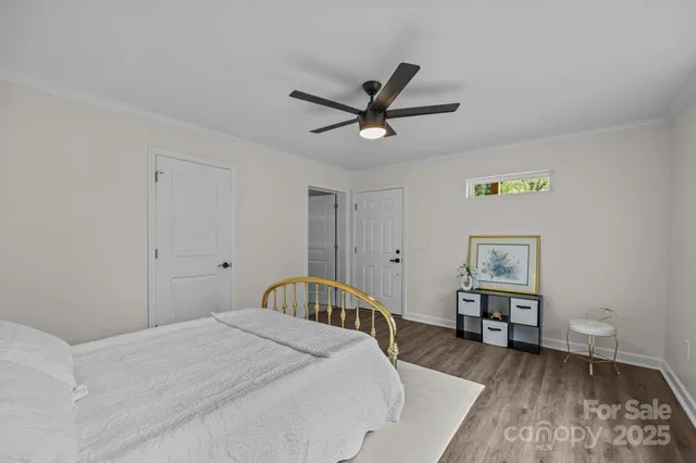 a bathroom with a double vanity sink toilet and shower