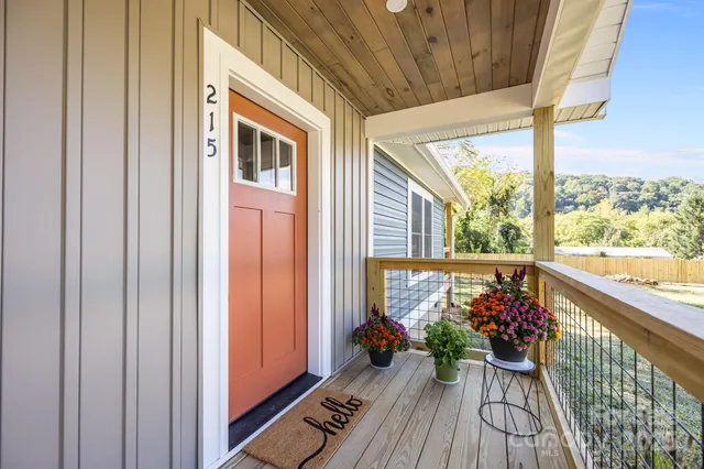 a view of a porch with wooden floor and outdoor space